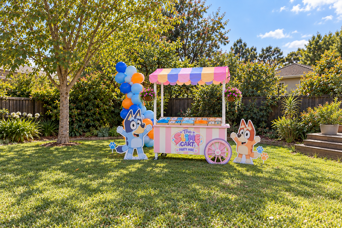 Bluey themed Slime Cart in a backyard with blue and orange balloons